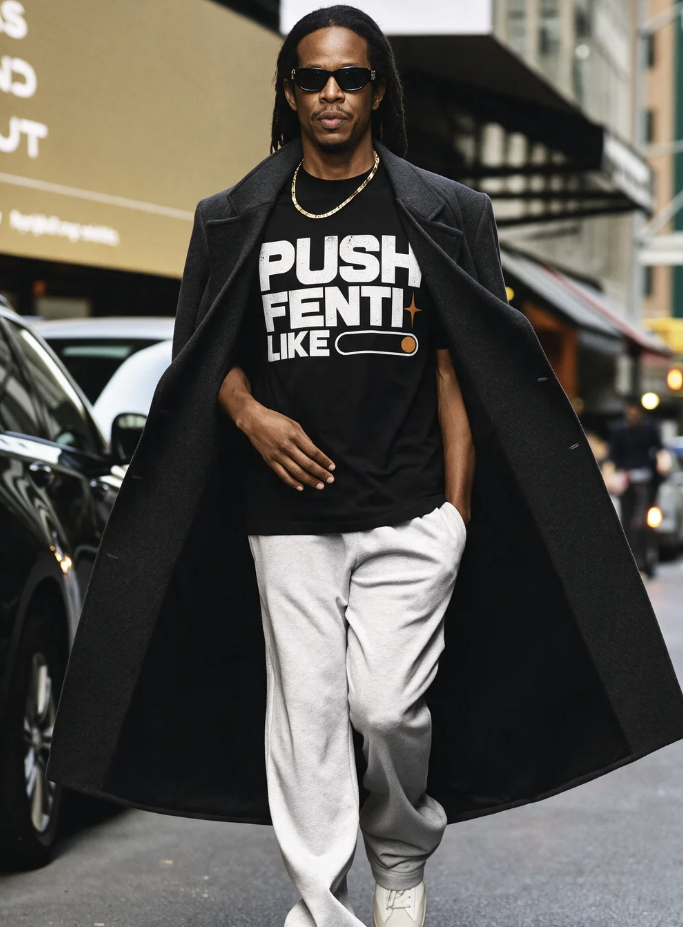 Male model wearing the FENTI Drop 001 tee, showing the PUSH FENTI LIKE front graphic